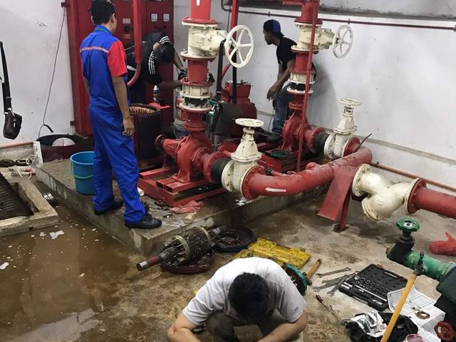 Technician repairing fire pump components